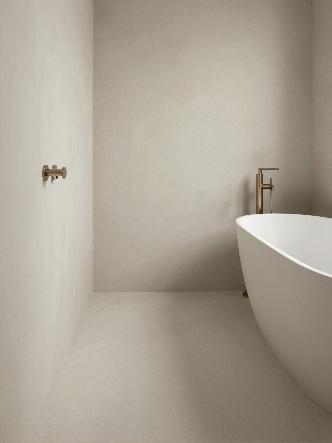 Microcement bathroom with freestanding bath